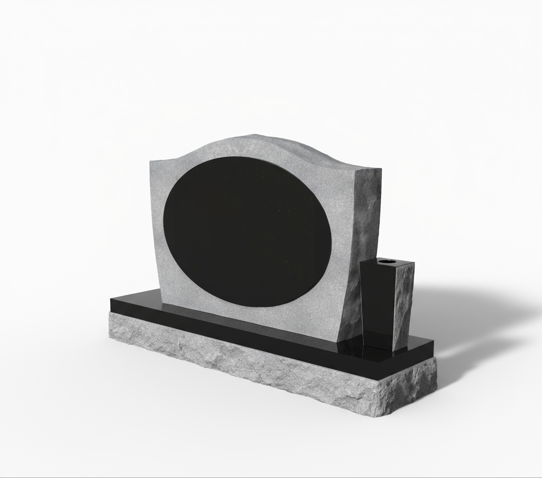A modern gray granite headstone with a smooth black oval panel ready for engraving, flanked by a polished black vase. The base features a natural rock-pitched edge, combining contemporary design with rugged elegance. Ideal for personalized memorial artwork.