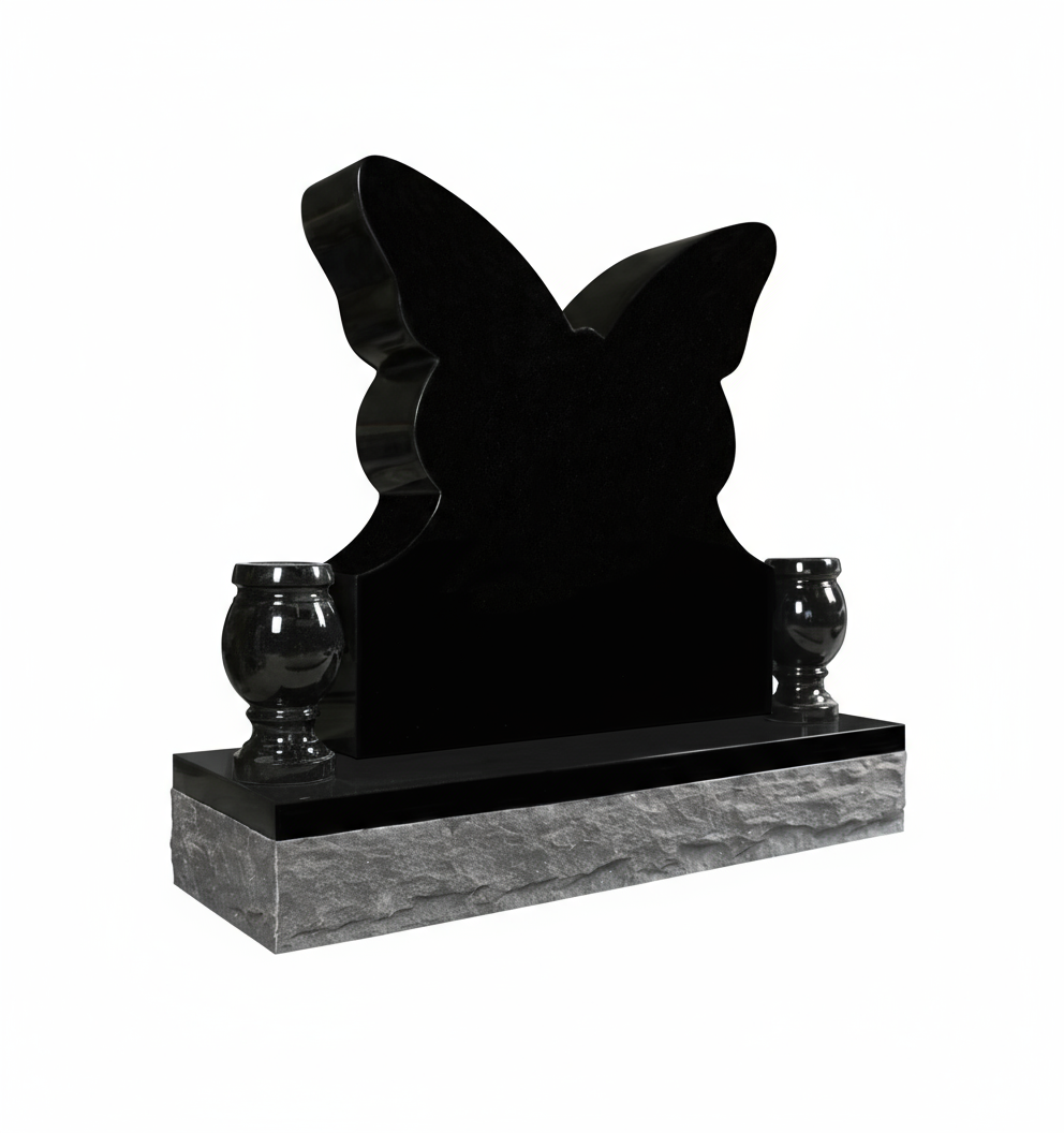 A striking black granite headstone shaped like a butterfly with smooth, polished surfaces and soft curves. It is flanked by two matching black granite urns, resting on a textured, rock-faced gray granite base, conveying a sense of modern elegance and profound symbolism.