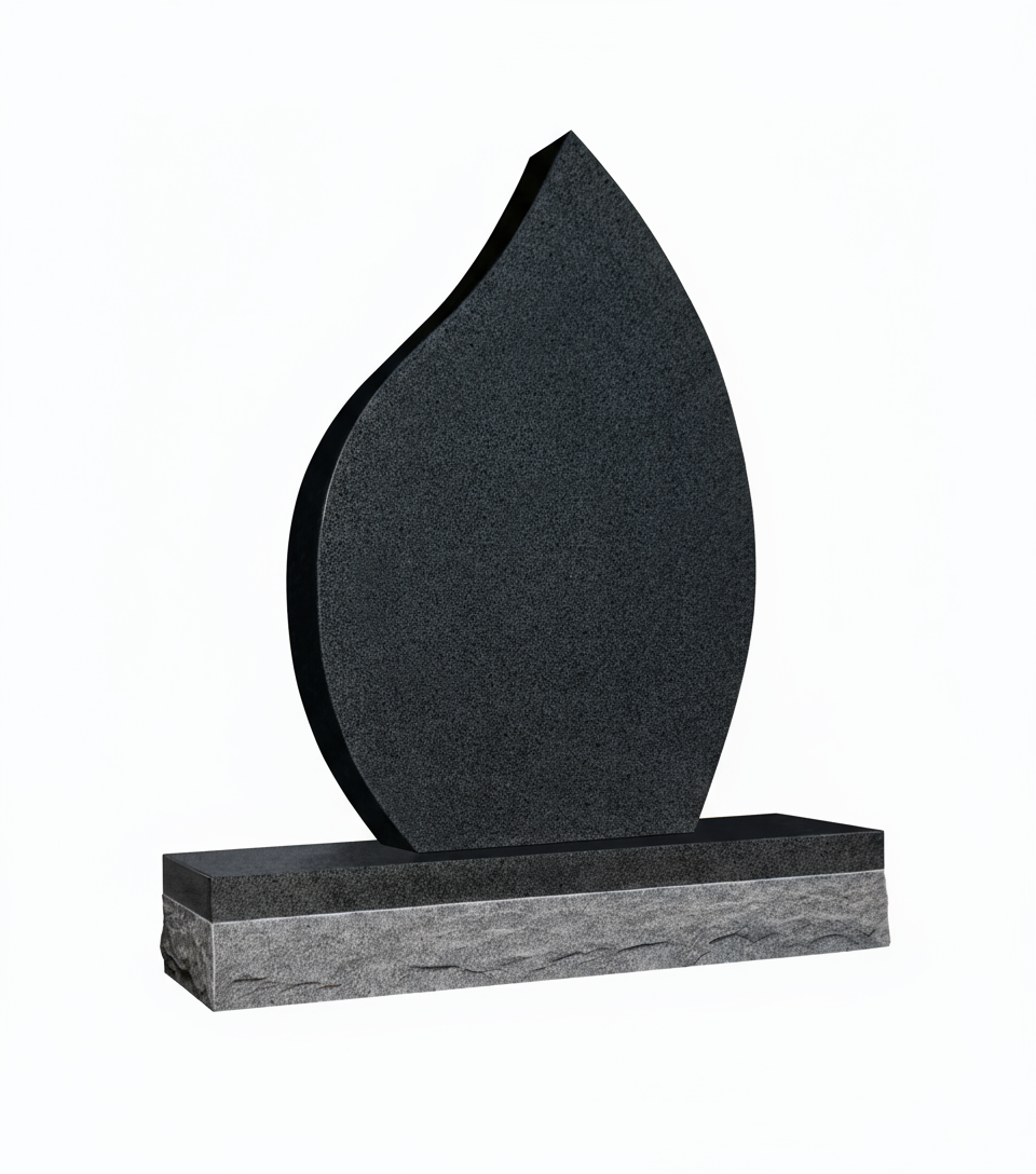 A modern, flame-shaped memorial headstone made of dark, speckled granite, standing on a polished black base atop a textured grey granite block. The piece symbolizes eternal remembrance and spiritual light.
