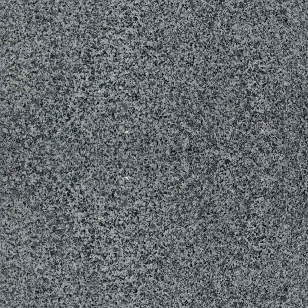 A close-up image of a fine-grained granite surface, exhibiting a uniform speckled pattern of various shades of gray, black, and white. This natural stone texture is commonly used for headstones and memorials, representing durability and timelessness.