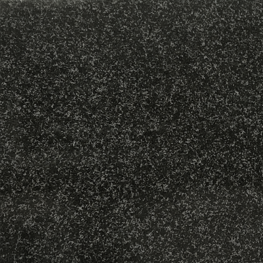 A close-up image of polished black granite, revealing its fine-grained texture with numerous tiny light-grey and white speckles. This natural stone background is often used for memorial artwork and epitaphs due to its durability and elegant appearance.