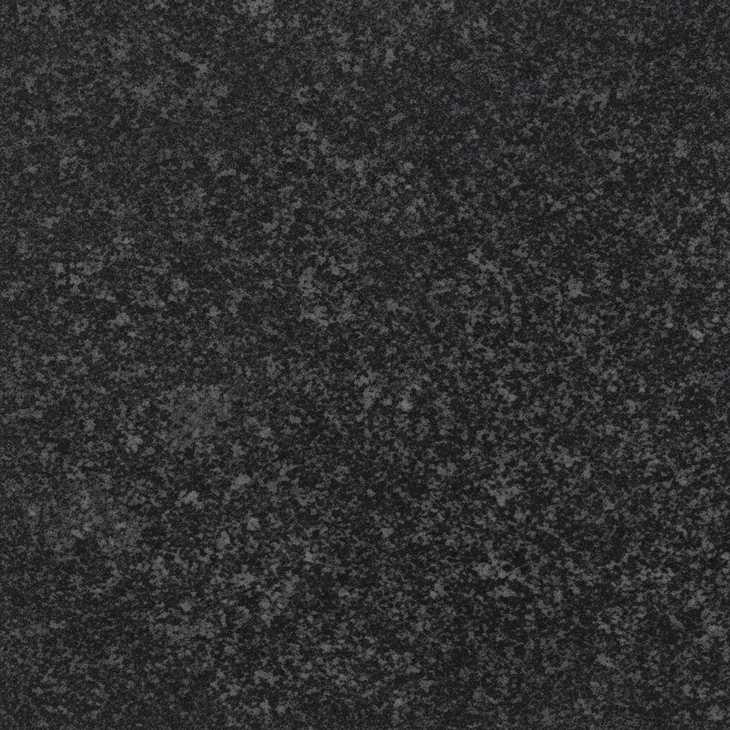 A close-up image of a black granite surface, showing its finely speckled texture of dark grey and black granules. This natural stone background is ideal for memorial artwork, providing a classic and durable foundation for engraved designs.