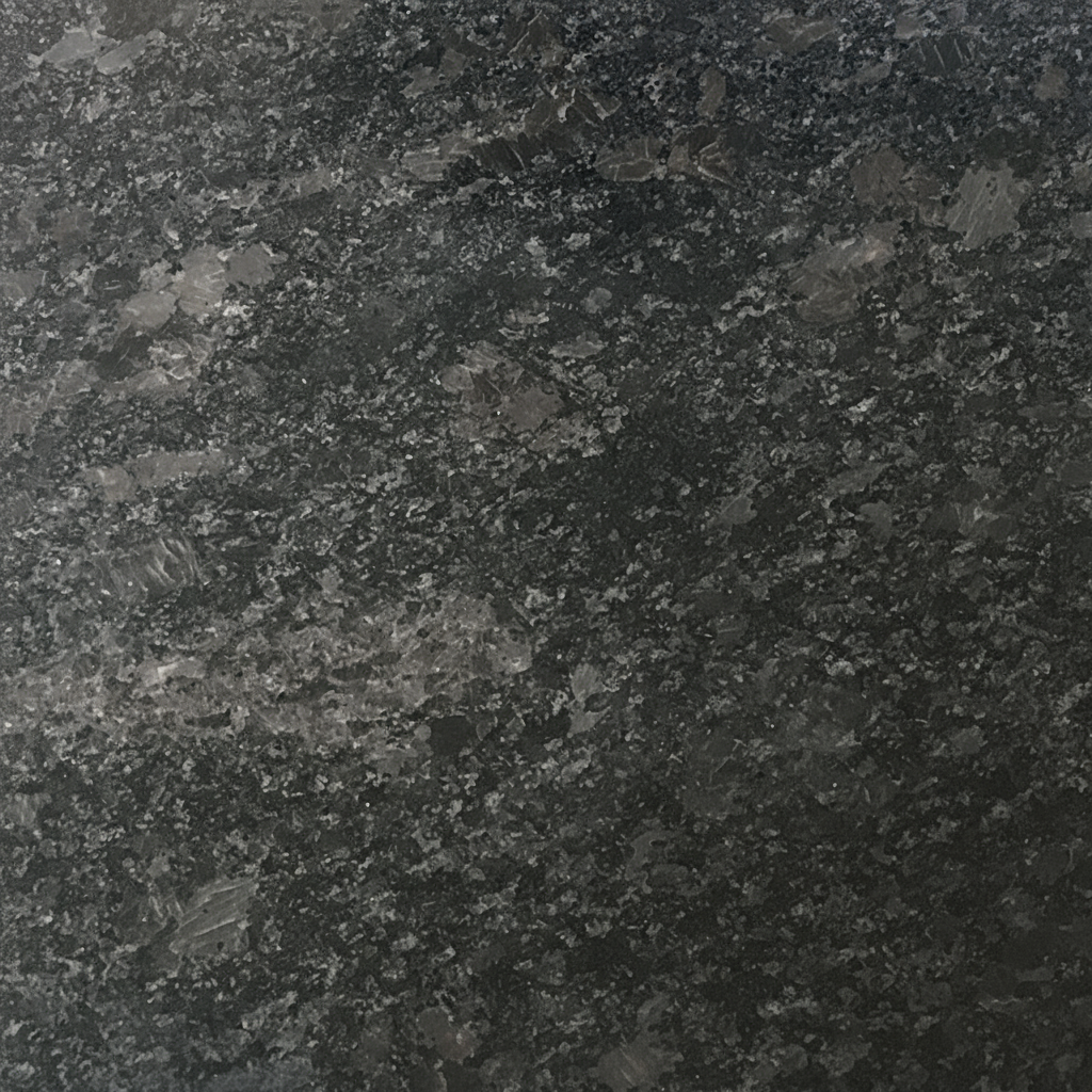 A close-up image of a dark black and grey granite texture, featuring small, glistening crystalline flecks across its uniform surface. This natural stone background is suitable for various memorial designs and engravings.