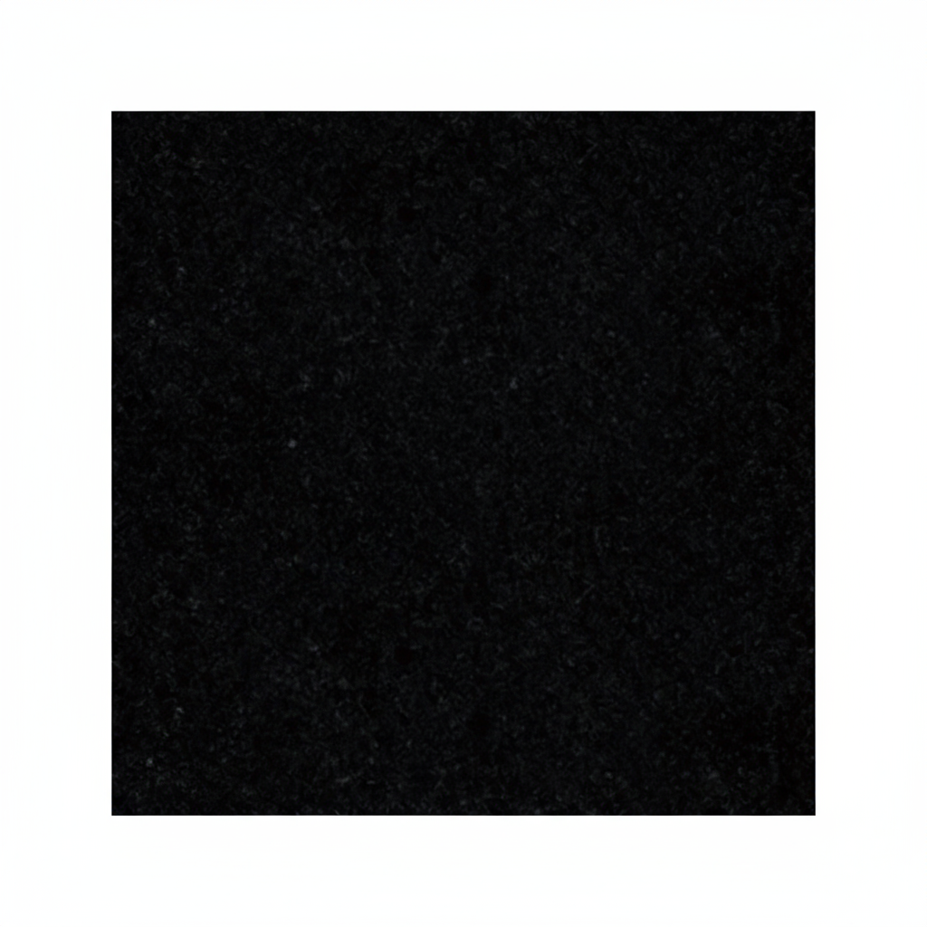 A close-up image of a solid black granite surface, revealing its fine, uniform texture and dark, consistent color. This material is widely used for memorial engravings due to its durability and elegant appearance.